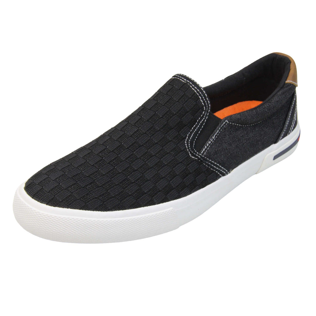 Mens mesh trainers. Black loafer style trainers with the upper made up of woven mesh for the front half and denim effect textile for the back. With a brown faux-leather half circle to the heel with Oakenwood logo on. Black elasticated side gussets and black textile lining with bright orange insole. Thick white sole. Left foot at an angle.