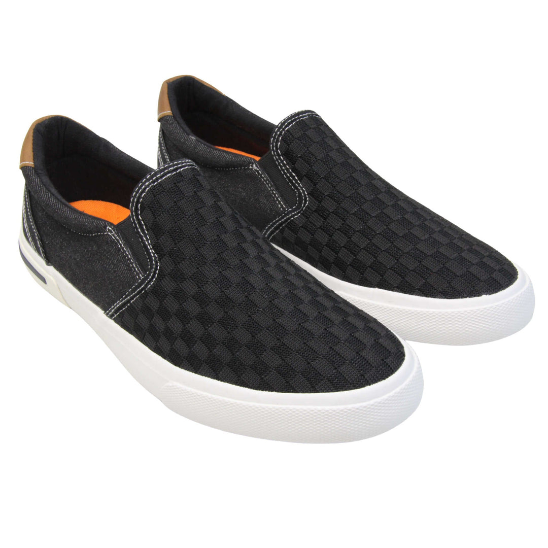 Mens mesh trainers. Black loafer style trainers with the upper made up of woven mesh for the front half and denim effect textile for the back. With a brown faux-leather half circle to the heel with Oakenwood logo on. Black elasticated side gussets and black textile lining with bright orange insole. Thick white sole. Both feet together at an angle.