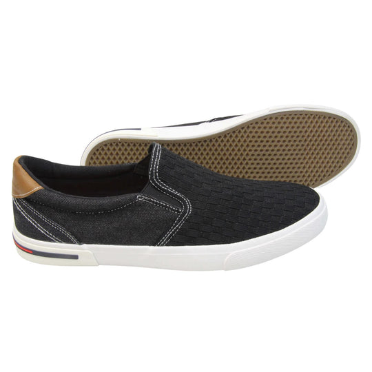 Mens mesh trainers. Black loafer style trainers with the upper made up of woven mesh for the front half and denim effect textile for the back. With a brown faux-leather half circle to the heel with Oakenwood logo on. Black elasticated side gussets and black textile lining with bright orange insole. Thick white sole.  Both feet from a side profile with the left foot on its side behind the the right foot to show the sole.