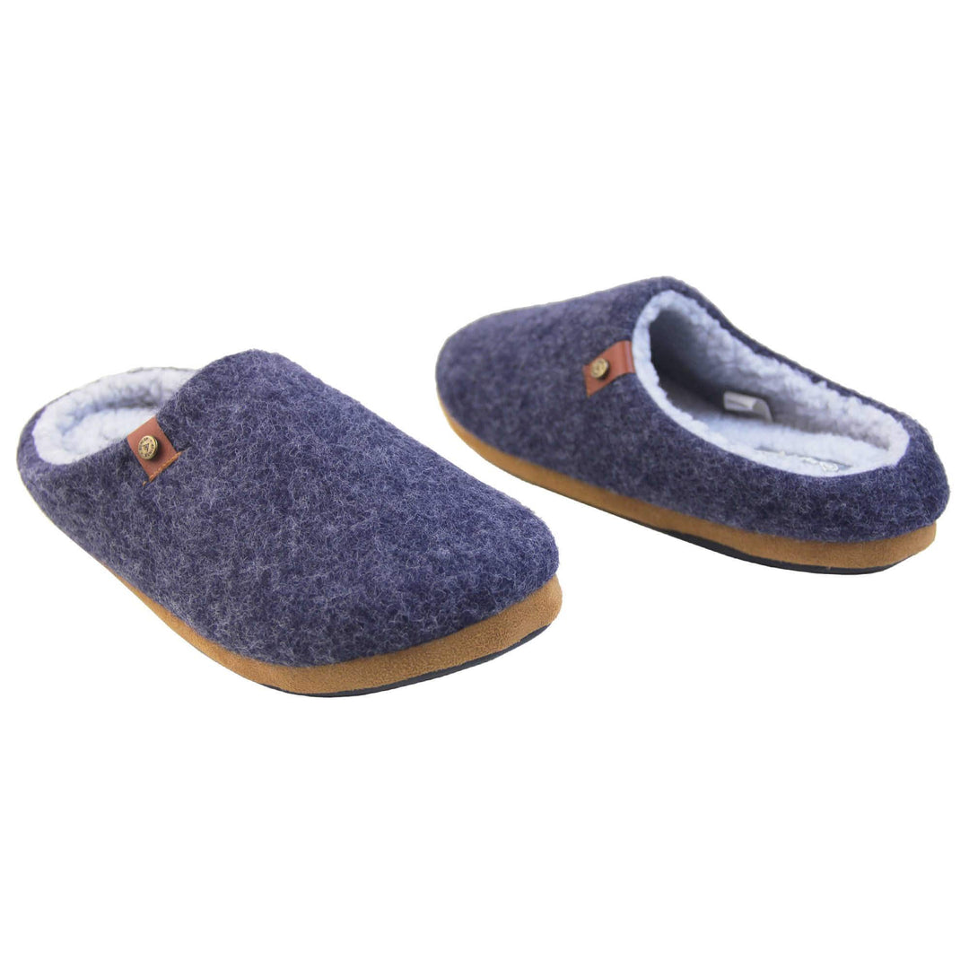 Mens mule slippers. Mule style slippers with a navy blue felt upper with brown rim around the base and a brown faux leather strap with stud detail along the collar of the slipper. Grey Wool effect faux fur lining with a grey Dunlop label on the middle of the insole. Firm black sole with wavy lines for grip. Both feet at an angle facing top to tail.