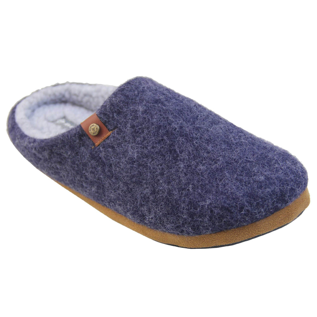 Mens mule slippers. Mule style slippers with a navy blue felt upper with brown rim around the base and a brown faux leather strap with std detail along the collar of the slipper. Grey Wool effect faux fur lining with a grey Dunlop label on the middle of the insole. Firm black sole with wavy lines for grip. Right foot at an angle.