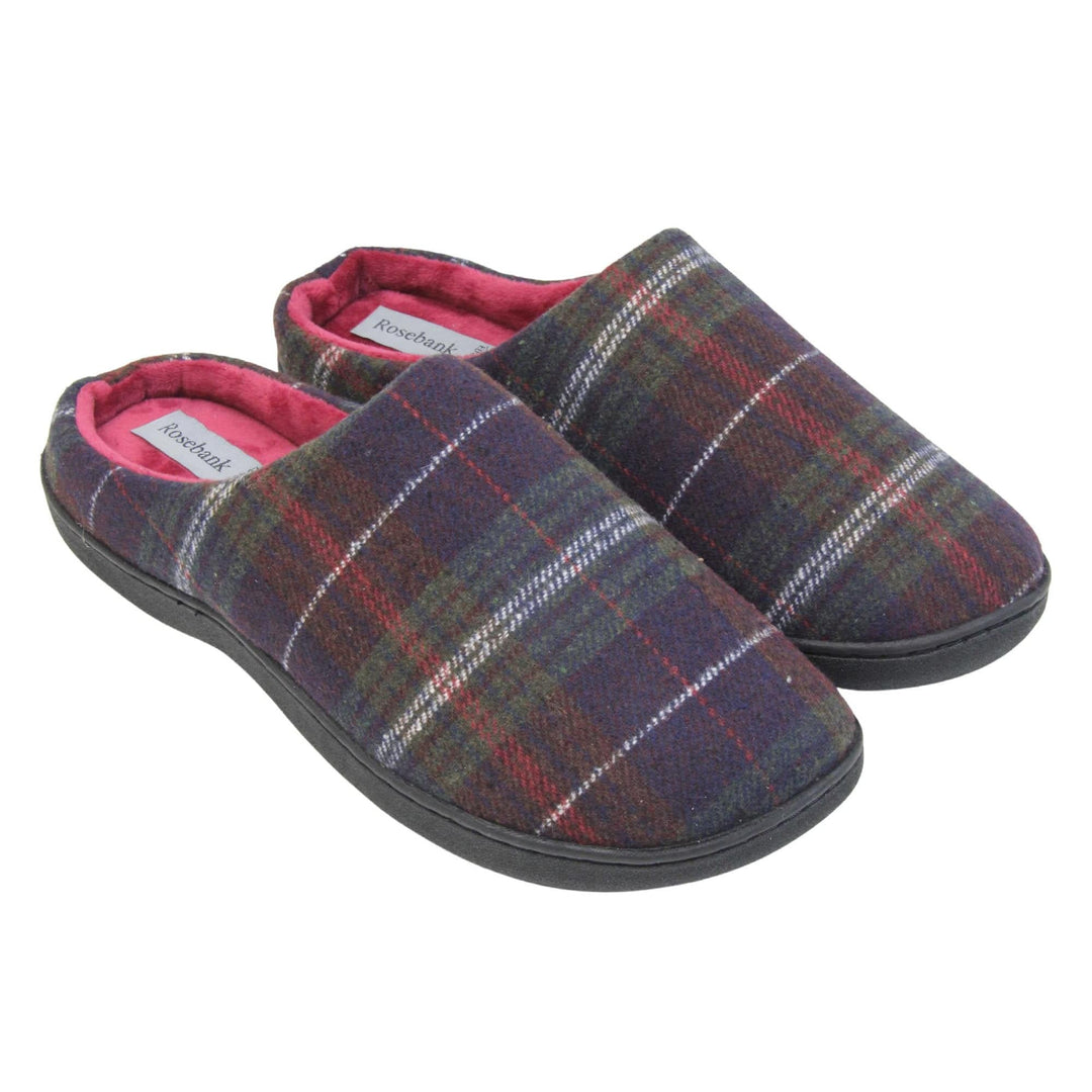 Mule slippers for men. Mule style slippers with fleecy navy and red tartan uppers. Red terry lining and firm black sole. Both feet together at an angle.
