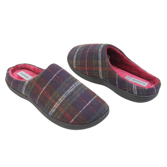 Mule slippers for men. Mule style slippers with fleecy navy and red tartan uppers. Red terry lining and firm black sole. Both feet at an angle facing top to tail.