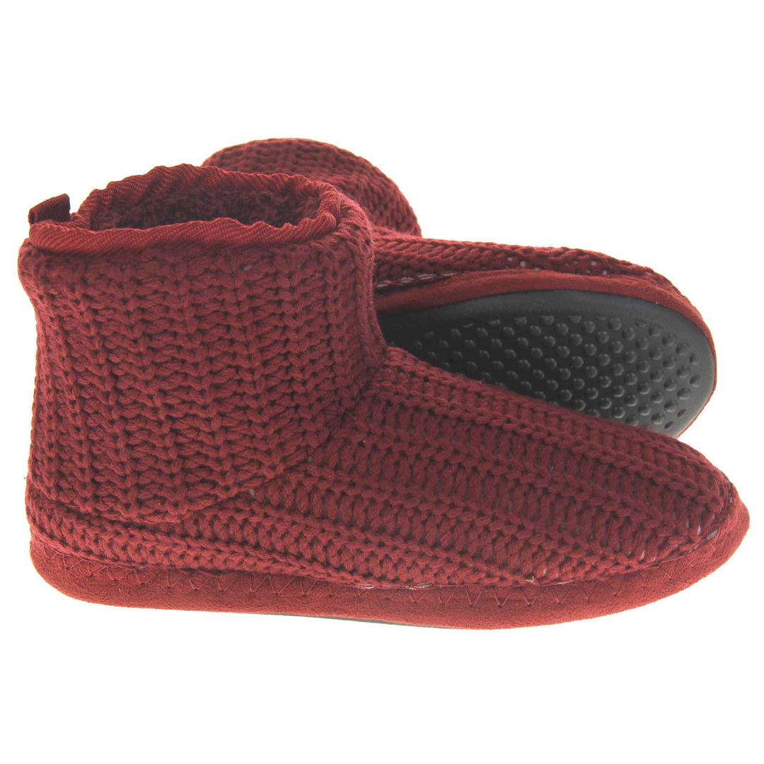 Mens red slippers. Slipper boots with a burgundy knit upper. Red fabric piping around the collar. Black synthetic sole. Red faux fur lining. Both slippers from side profile with left foot on its side behind the right to show the sole.