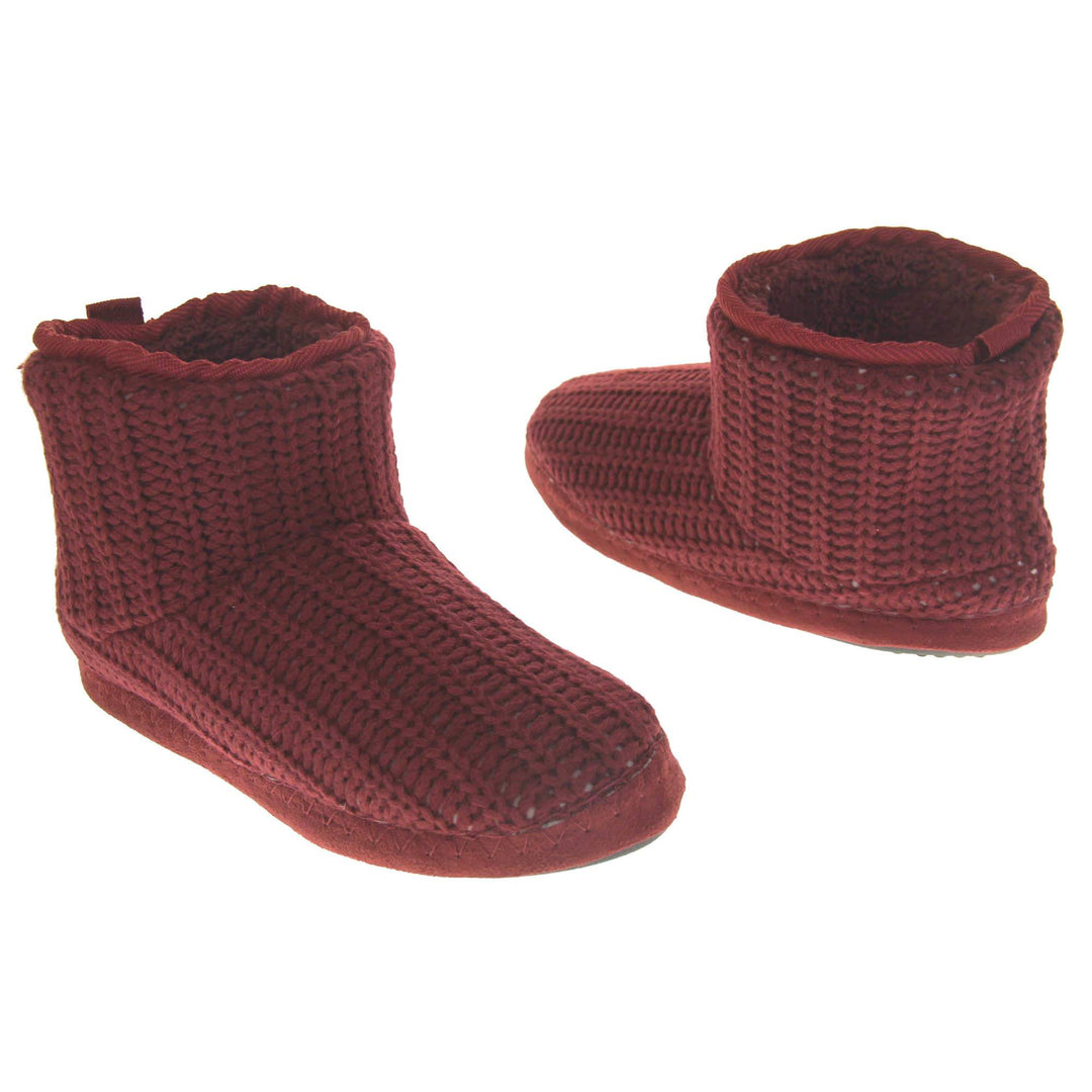 Mens red slippers. Slipper boots with a burgundy knit upper. Red fabric piping around the collar. Black synthetic sole. Red faux fur lining. Both slippers slightly at an angle facing top to tail.