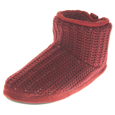 Mens red slippers. Slipper boots with a burgundy knit upper. Red fabric piping around the collar. Black synthetic sole. Red faux fur lining. Left foot at an angle.