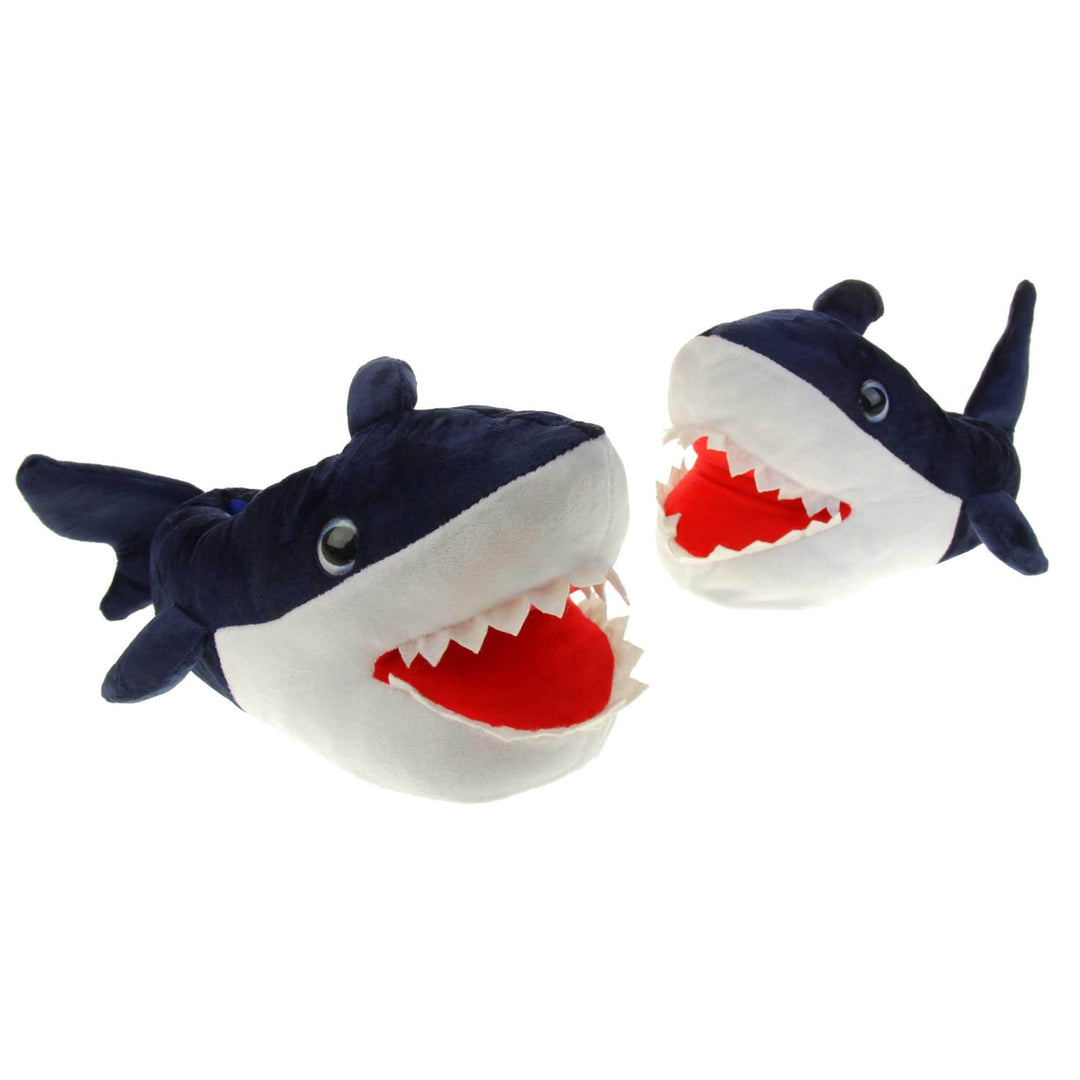 Mens shark slippers. Padded slippers in the shape of a shark with its mouth open. Blue upper and tail and white mouth and belly. Mouth is red felt with white felt shark teeth around the edge. Blue false eyes. Both feet in a v shape, left foot slightly behind.