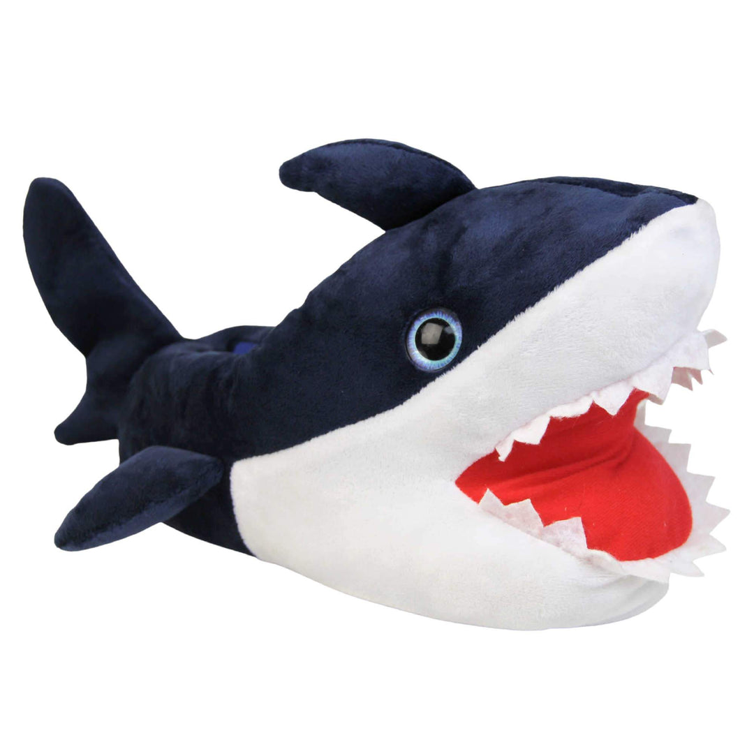 Mens shark slippers. Padded slippers in the shape of a shark with its mouth open. Blue upper and tail and white mouth and belly. Mouth is red felt with white felt shark teeth around the edge. Blue false eyes. Right foot at an angle.