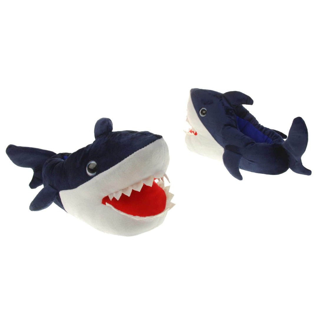 Mens shark slippers. Padded slippers in the shape of a shark with its mouth open. Blue upper and tail and white mouth and belly. Mouth is red felt with white felt shark teeth around the edge. Blue false eyes. Both feet slightly at an angle facing top to tail.