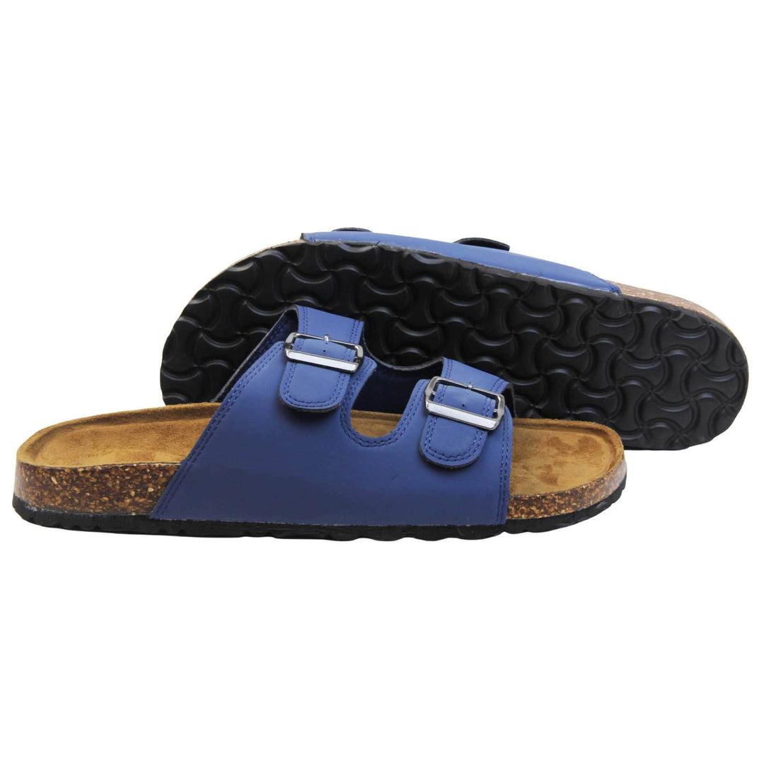 Mens Sliders. Double strap navy blue faux leather upper with silver buckles. Brown faux suede insole with Dunlop branding. Cork style outsole with black base. Both feet from a side profile with left foot behind the right on its side to show the sole.