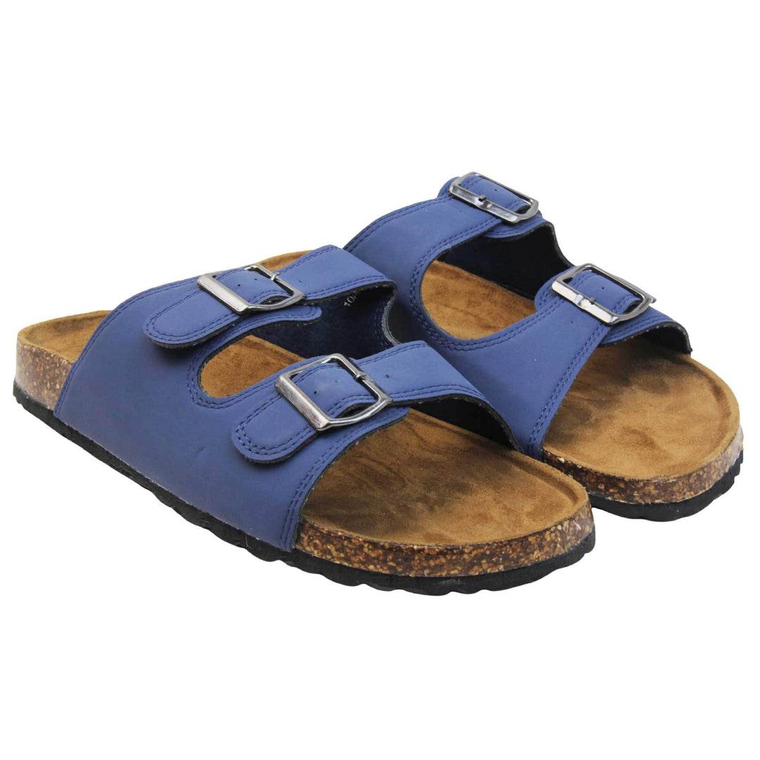 Mens Sliders. Double strap navy blue faux leather upper with silver buckles. Brown faux suede insole with Dunlop branding. Cork style outsole with black base. Both feet together at a slight angle.