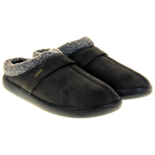 Mens slip on mules. Mens slippers in a mule style. With dark grey faux suede upper. Black fleece lining and grey faux fur collar. Black hard synthetic soles with grip to the base. Both feet together from a slight angle.