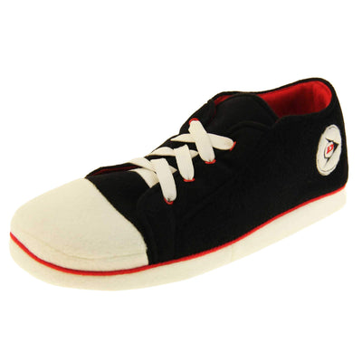 Mens sneaker slippers. Black soft fabric upper in low-rise sneaker style. With white elasticated laces and white circle with Dunlop logo to the side. White edge around the sole of the shoe. Red textile lining. Black sole with bumps for grips. Left foot at an angle.