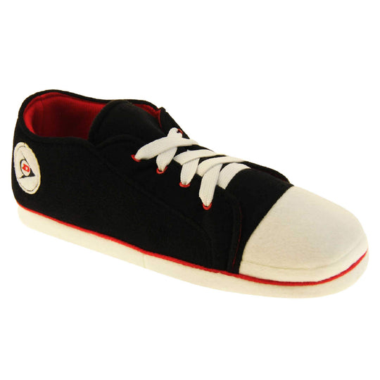 Mens sneaker slippers. Black soft fabric upper in low-rise sneaker style. With white elasticated laces and white circle with Dunlop logo to the side. White edge around the sole of the shoe. Red textile lining. Black sole with bumps for grips. Right foot at an angle.