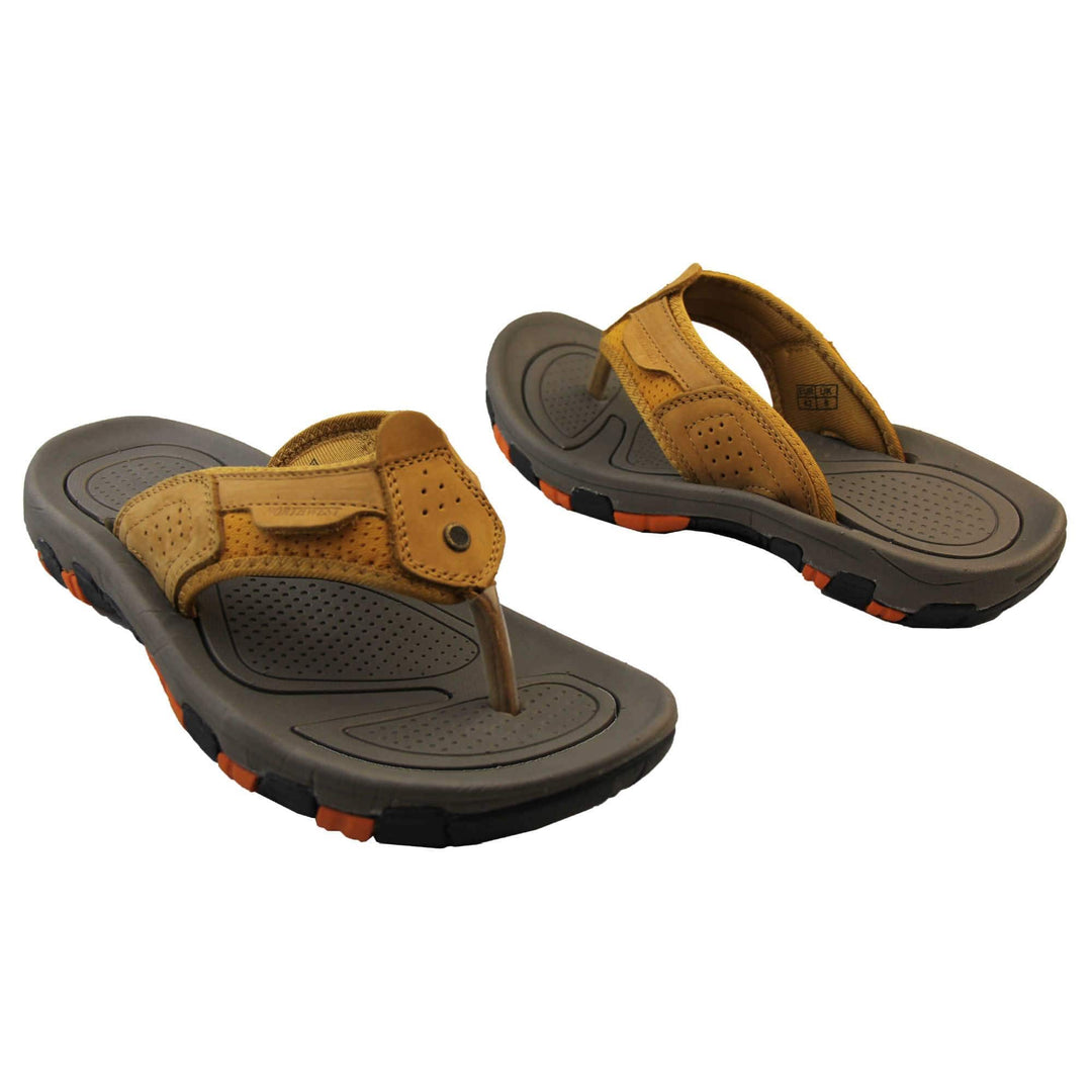 Mens sport flip flops. Brown suede leather upper with stitching detail. Black synthetic sole with orange grip to the base. Both feet about an inch apart at an angle facing top to tail.