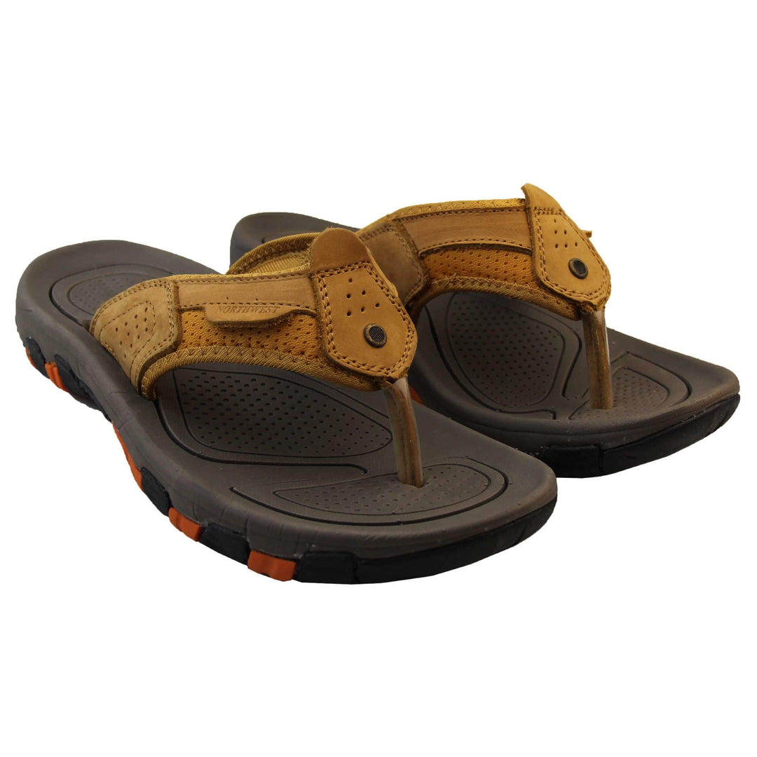 Mens sport flip flops. Brown suede leather upper with stitching detail. Black synthetic sole with orange grip to the base. Both feet together from a slight angle.