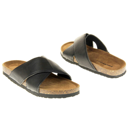 Mens two strap sandals. Black faux leather upper of two thick straps crossed over each other. Brown faux suede insole with Dunlop branding. Cork style outsole with black base.  Both feet at an angle facing top to tail.