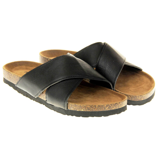 Mens two strap sandals. Black faux leather upper of two thick straps crossed over each other. Brown faux suede insole with Dunlop branding. Cork style outsole with black base. Both feet together at a slight angle.