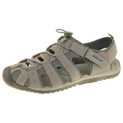 Mens walking sandals. Traditional style sandal with Light grey and dark grey fabric strappy upper. Black rubber toe caps and black synthetic sole with blue grips to the bottom. Elasticated laces to the front of the shoe and touch fasten strap by the ankle. Left foot at an angle.