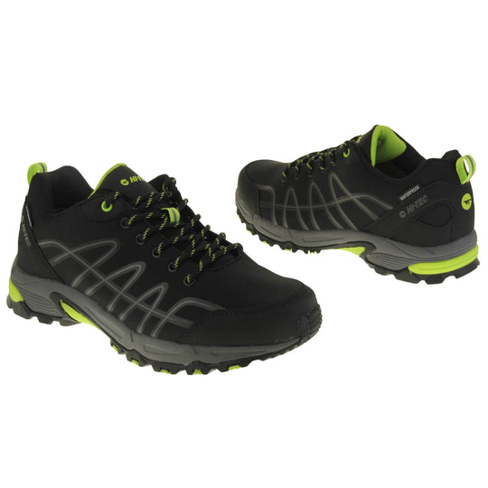 Mens walking shoes. Black trainers with a waterproof membrane. Light grey lines up the sides of the trainer outlined in dark grey. Chunky grey sole with neon yellow accents. Black laces with yellow lines on. Neon yellow tab to hold the tongue to the laces. Neon yellow Hi Tec branding on the tongue.Black fabric band on the heel with Hi Tec branding. Neon yellow loop to the back of the trainer to help pull trainers on. Both shoes at a slight angle facing top to tail.