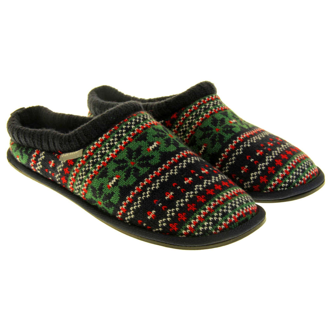 Mens warm mule slippers. Mens slippers in a mule style. With black knit fabric upper with green, red and white pattern. Black faux fur lining. Black hard synthetic soles with grip to the base. Both feet together from a slight angle.