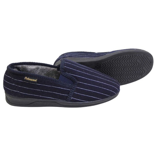 Mens warm slippers. Full back slippers with navy blue wool effect upper with white pin stripes. Navy elasticated panels joining the tongue to the top of the slippers. Small black label on the outside rim, with Oakenwood branding sewn in gold. Grey faux fur lining.  Both feet from side profile with left foot on its side to show the sole.