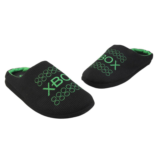 Mens xbox mule slippers. Mule style slippers with black textile uppers with green Xbox branding on the top. Green and black textile lining and firm black sole. Both feet in a wide V shape with the toes almost touching.