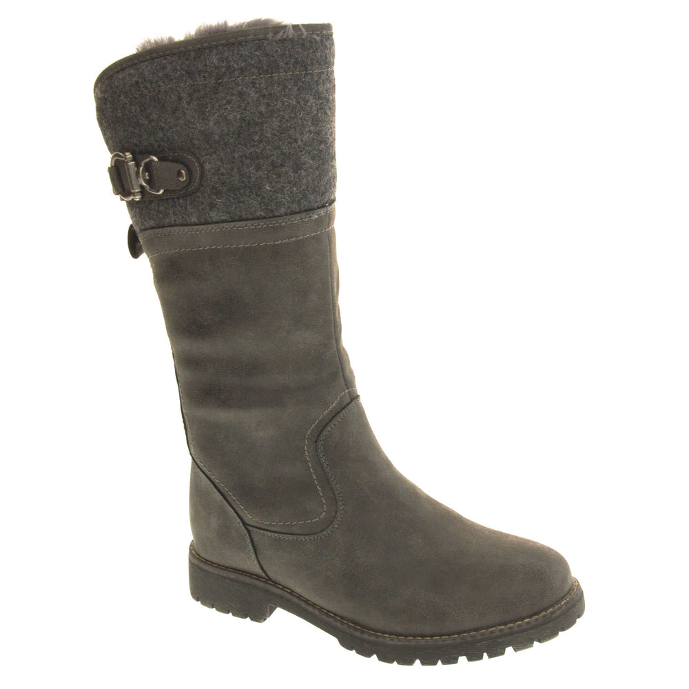 Mid calf winter boots. Women's boot in a below the knee style. With a grey faux leather upper and grey felt effect collar with grey buckle detail. Grey sole with chunky grip to the bottom. Zip fastening to the inside leg. Grey faux fur lining. Right foot at an angle.
