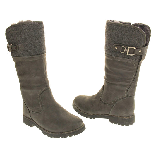 Mid calf winter boots. Women's boot in a below the knee style. With a grey faux leather upper and grey felt effect collar with grey buckle detail. Grey sole with chunky grip to the bottom. Zip fastening to the inside leg. Grey faux fur lining. Both feet from a slight angle facing top to tail.