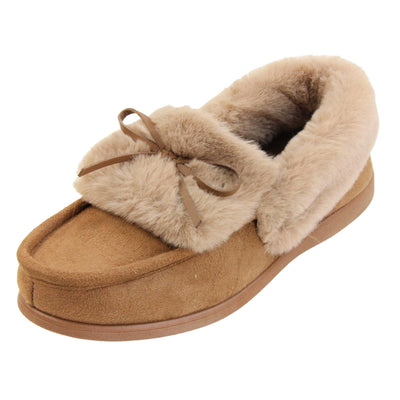 Moccasin slippers womens. Moccasin style slipper with a brown camel coloured faux suede upper and bow to the top. Light brown faux fur collar, tongue and lining. Brown rubber sole. Left foot at an angle.