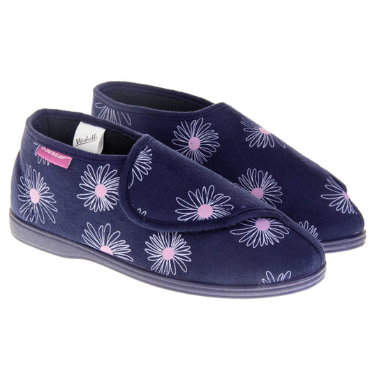 Navy blue slippers. Womens bootie style slipper with a navy blue textile upper with a white and pink flower print. Touch fasten tab to the top and blue textile lining. Firm navy sole. Both feet together at angle.