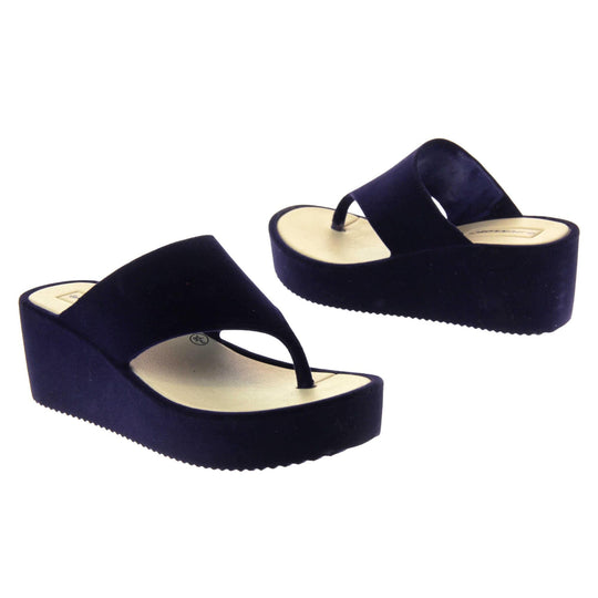 Womens Wedge Sandals - Dark blue velvet shoes with 2 inch wedge heels and an open toe post design. Both feet facing opposite directions.