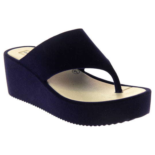 Womens Wedge Sandals - Dark blue velvet shoes with 2 inch wedge heels and an open toe post design. Right foot at angle.