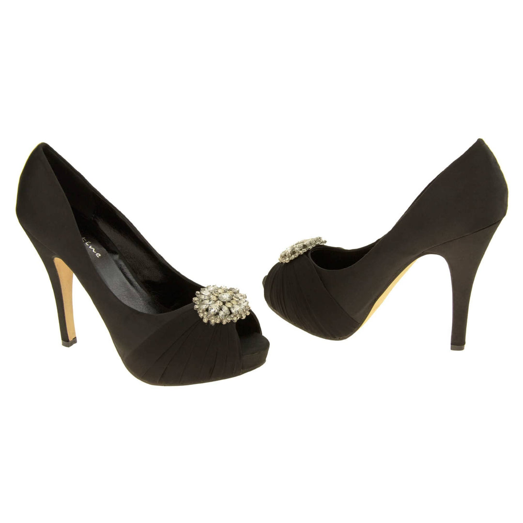 Peep toe black heels. Classic women's peep toe high heels with a black satin upper. Black insole with Sabatine branding. Black satin stiletto heel with a cream sole. Diamante cluster and ruched detailing across the toes. Both feet at an angle facing top to tail.