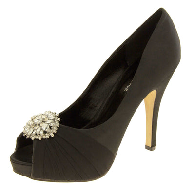 Peep toe black heels. Classic women's peep toe high heels with a black satin upper. Black insole with Sabatine branding. Black satin stiletto heel with a cream sole. Diamante cluster and ruched detailing across the toes. Left foot at an angle.