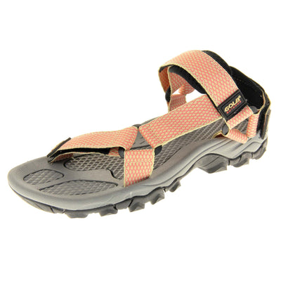 Pink walking sandals. Womens sporty style sandals. Beige textile straps with pink criss-cross pattern. Black padding to the heel and over foot strap. Touch fasten strap around the heel. Black Gola branding to the ankle of the sandal. Grey textile lining and black sole with chunky grip to the base. Left foot at an angle.