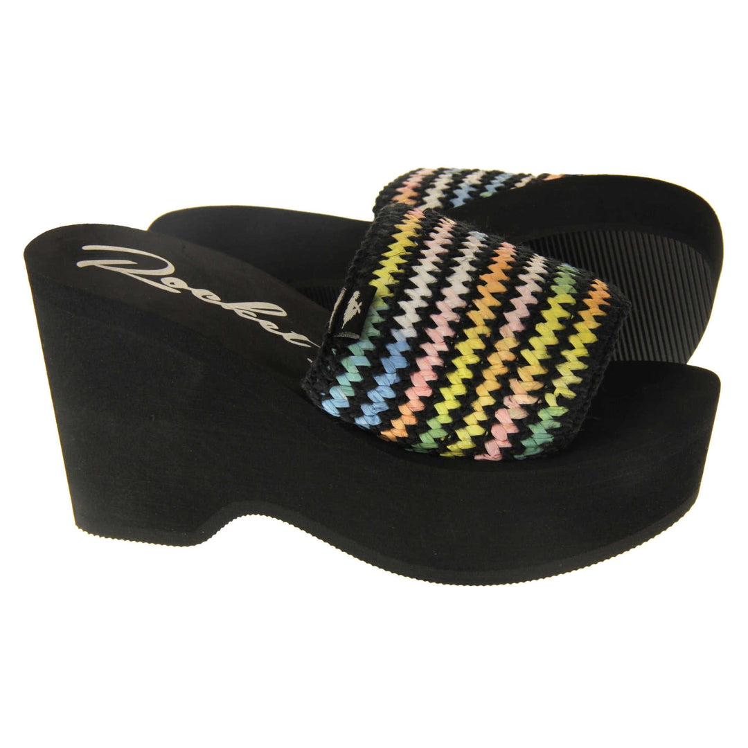 Womens Black Rocket Dog Sandals - Black foam sole and platform with a black hessian upper and a pastel rainbow zigzag design. Right foot side on with left foot outsole showing.