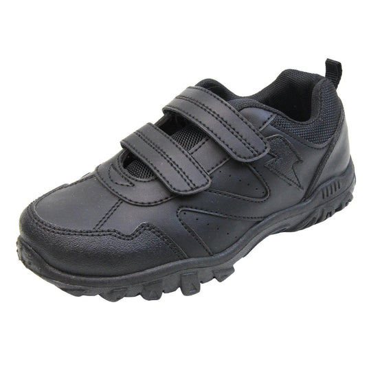 School trainers boy. Black faux leather trainers with zig zag detailing along the sides and a lightning bolt near the ankle. Two black touch fasten straps across the foot with a black textile lining. Chunky black soles. Left foot at an angle.