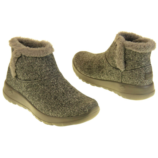 Skechers Boots UK. Grey wool blend boots. With grey faux fur collar and side edging. Grey chunky synthetic rubber sole with weave effect grip to the bottom. Grey faux fur lining inside the boot. Both boots facing top to tail.