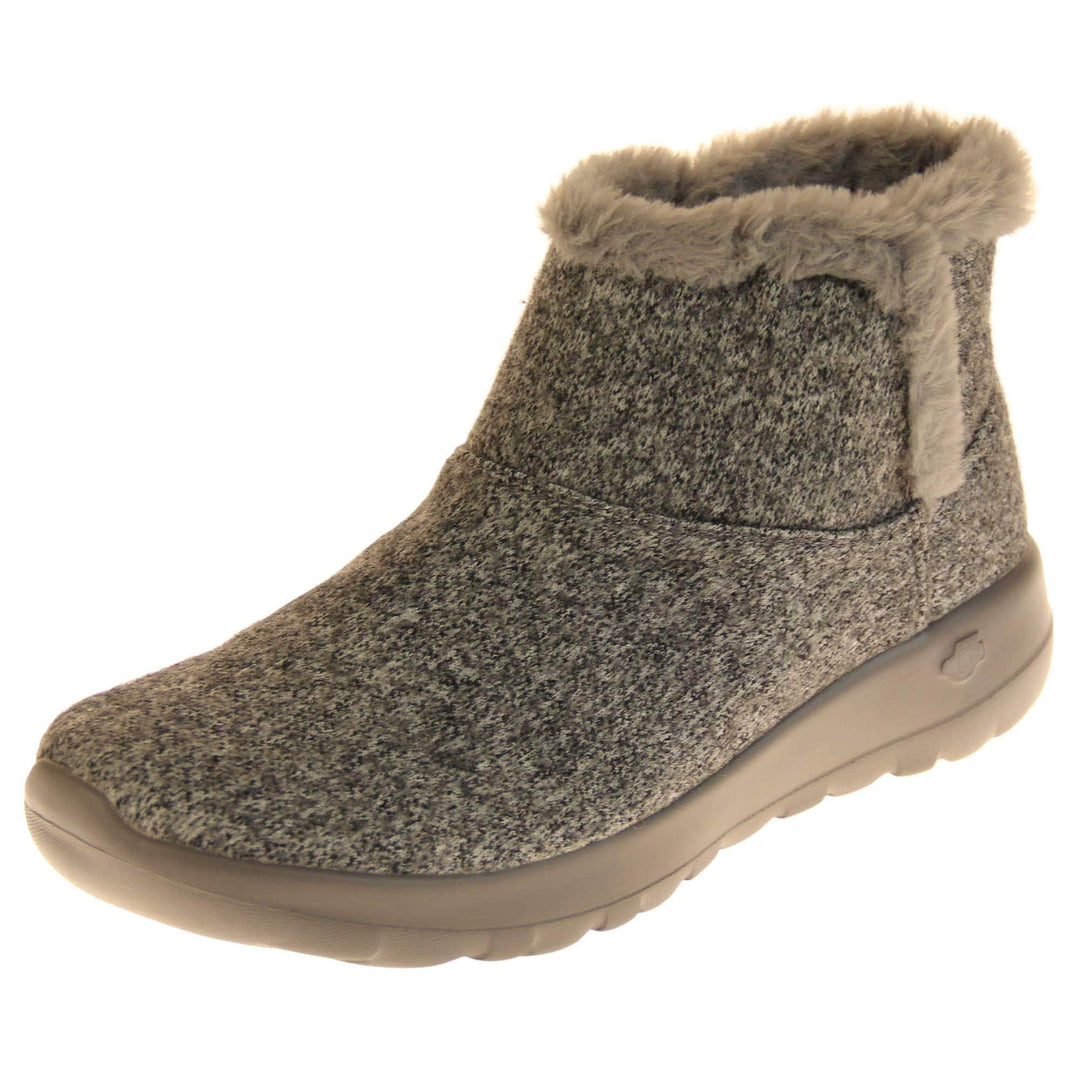 Skechers Boots UK. Grey wool blend boots. With grey faux fur collar and side edging. Grey chunky synthetic rubber sole with weave effect grip to the bottom. Grey faux fur lining inside the boot. Left foot at an angle.