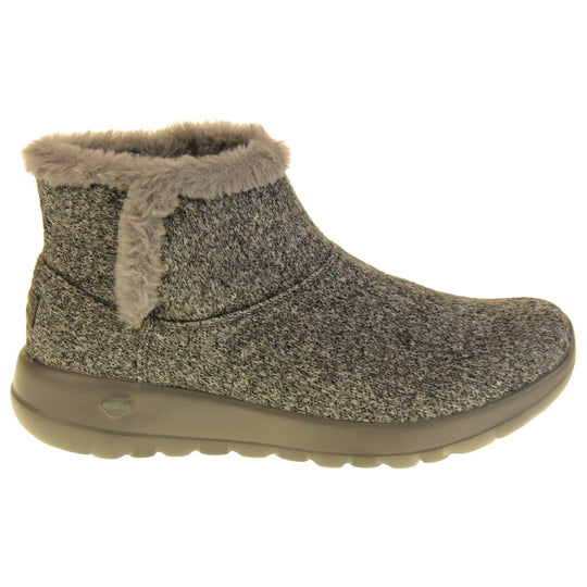 Skechers Boots UK. Grey wool blend boots. With grey faux fur collar and side edging. Grey chunky synthetic rubber sole with weave effect grip to the bottom. Grey faux fur lining inside the boot. Right foot from side profile.