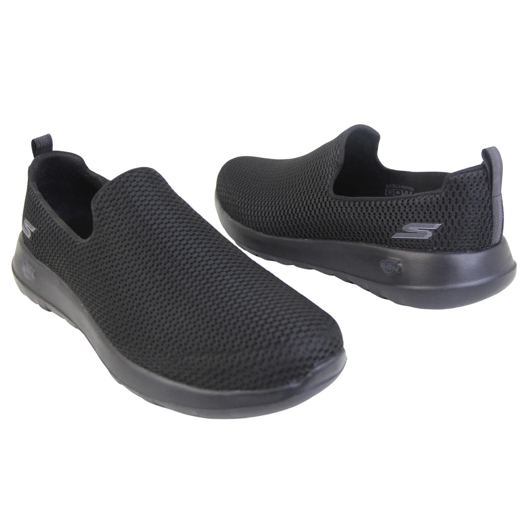 Skechers go walk max. Mens loafer style shoes with a trainer sole. Black woven mesh upper. Skechers S logo to the back. Black sole with grip to the bottom. Black textile lining. Both feet from a slight angle facing top to tail.