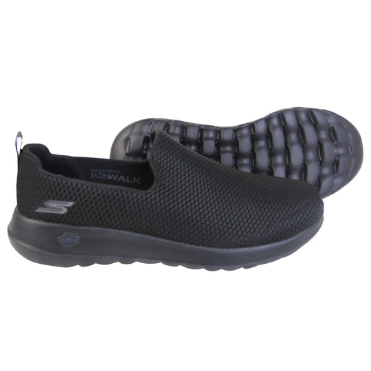 Skechers go walk max. Mens loafer style shoes with a trainer sole. Black woven mesh upper. Skechers S logo to the back. Black sole with grip to the bottom. Black textile lining. Both feet from a side profile with the left foot on its side to show the sole.