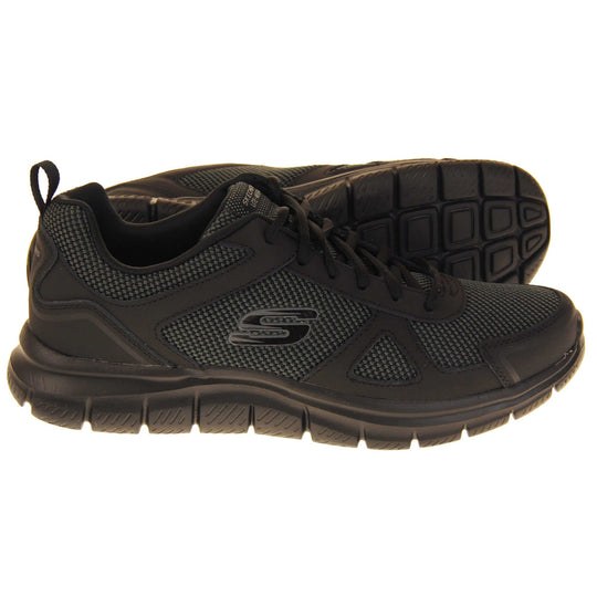 Skecher light weight. Black mesh and leather upper with black laces and black textile lining. Grey and black Skechers logo to the side and chunky black outsole with grip. Both feet from a side profile with the left foot on its side to show the sole.