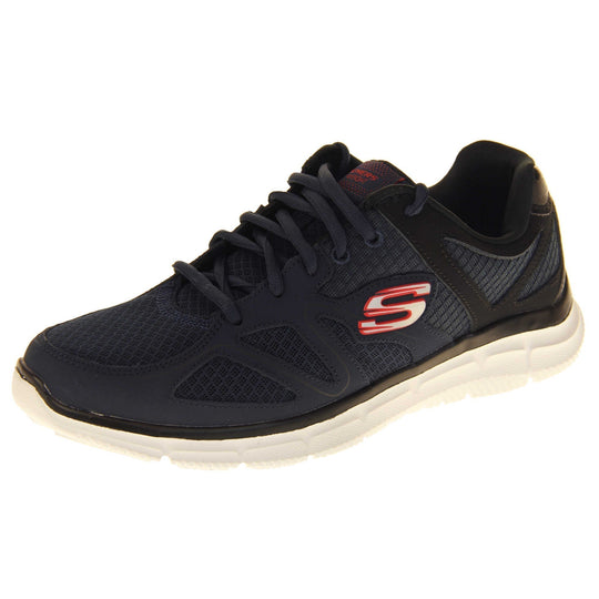 Skechers mens trainers Navy blue mesh and leather upper with black leather accents to the back. Navy laces and black textile lining. Red and white Skechers logo to the side and chunky white outsole with grip. Left foot at an angle.
