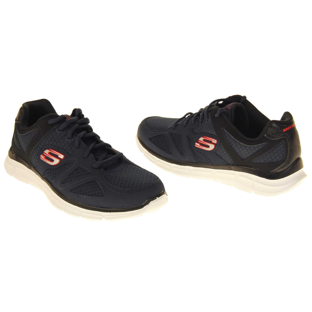 Skechers mens trainers Navy blue mesh and leather upper with black leather accents to the back. Navy laces and black textile lining. Red and white Skechers logo to the side and chunky white outsole with grip. Both feet at a slight angle facing top to tail.