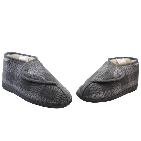 Orthopaedic slippers. Mens orthopaedic slippers in an ankle boot style. With a grey plaid upper and white fleece lining. With an adjustable touch close top with a grey Dunlop logo on. Small grey label to the outer side edge with Dunlop written on. Thick black outdoor sole. Both feet in a wide V shape with toes almost toching.