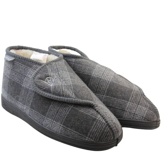 Orthopaedic slippers. Mens orthopaedic slippers in an ankle boot style. With a grey plaid upper and white fleece lining. With an adjustable touch close top with a grey Dunlop logo on. Small grey label to the outer side edge with Dunlop written on. Thick black outdoor sole. Both feet together at an angle