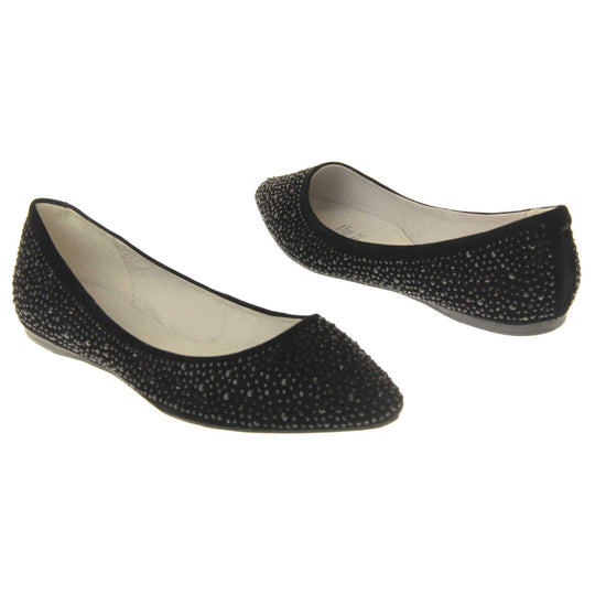 Sparkly shoes flat. Ballet style shoes with a black faux suede upper covered in black diamantes. Cream leather lining and black sole.  Both feet at an angle facing top to tail.