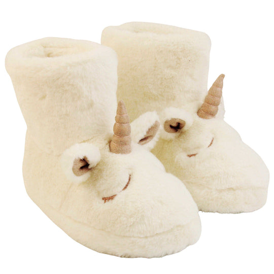 Sparkly unicorn slipper boots. Furry slipper boots in white with a cute unicorn face on. With glittery ears and horn. The same colour faux fur lines the boot. Both feet together at a slight angle.